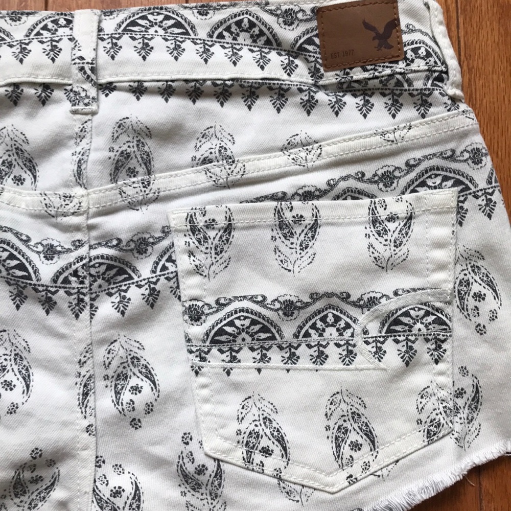 white with black print shorts